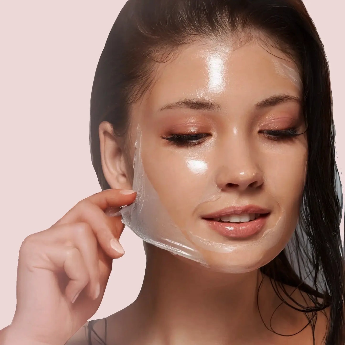 Woman using Overnight Collagen Renewal Dream Mask